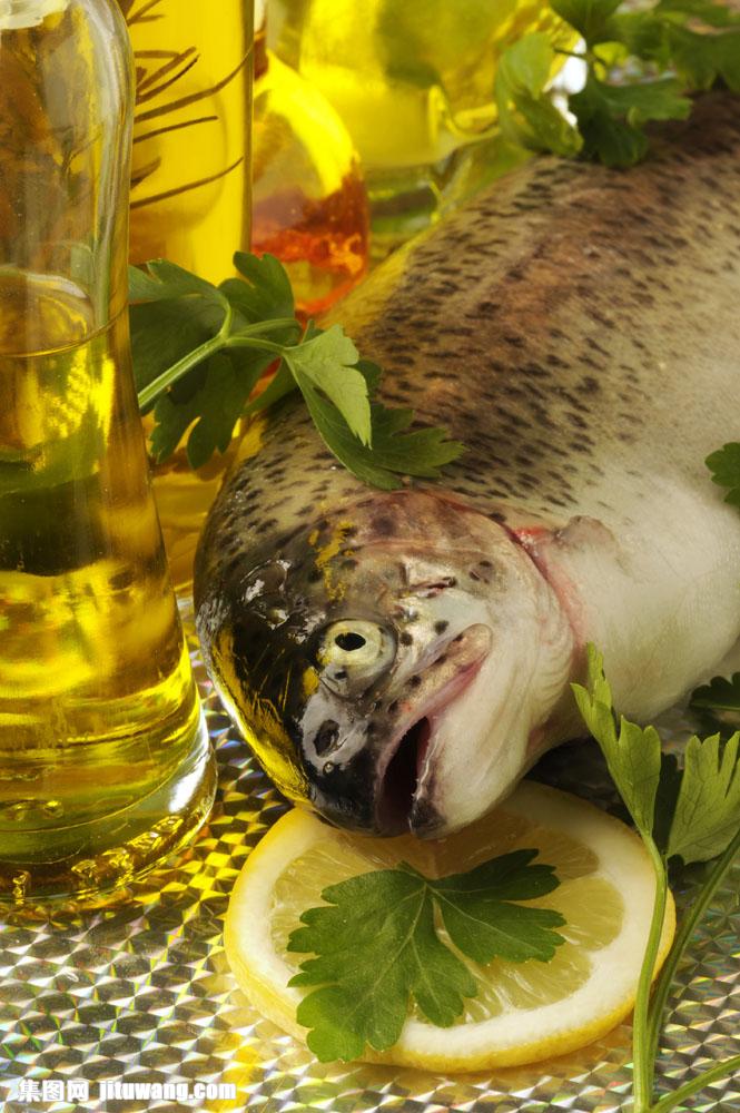 Olive oil and fresh fish with greens (1)